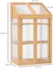 A wooden greenhouse with clear panels and double doors, shown with dimensions indicated. Voir les images du produit