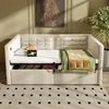 A beige upholstered daybed with storage drawers, a green and gold throw blanket, and a charging device with a lightning bolt symbol. Produktbild-Vorschau