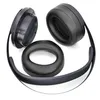 Disassembled black headphones and ear pads on a white background. Produktbild-Vorschau