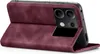 A burgundy flip case for a smartphone is shown open, revealing the phone's camera module. Produktbild-Vorschau