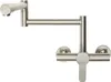 A silver-colored kitchen faucet with a foldable spout and a single handle, mounted on a white background. Podgląd zdjęcia produktu