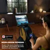 A woman is using a rowing machine in a well-lit room with a window overlooking trees. Produktbild-Vorschau