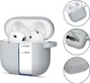 A collage of images showing an AirPods case with AirPods inside, a close-up of the case's texture, a key inserted into the case, and the bottom of the case. Anteprima dell’immagine prodotto