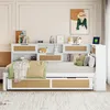 A bedroom scene featuring a daybed with integrated storage and shelving, decorated with pillows and blankets. Voir les images du produit