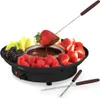A chocolate fondue set with various fruits. Produktbild-Vorschau