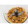 A close-up shot of chopped vegetables inside a food processor bowl with the blades visible. Produktbild-Vorschau