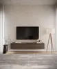 A modern living room with a wall-mounted TV board and a floor lamp. Voir les images du produit