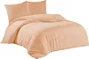 A peach-colored duvet cover and two pillowcases are neatly arranged on a bed, presented against a plain white background. Produktbild-Vorschau