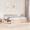 A wooden bed frame with drawers is shown in a bedroom setting. Produktbild-Vorschau