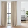 A room with a window covered by beige curtains. Podgląd zdjęcia produktu