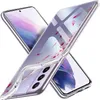 Two clear phone cases with a floral pattern are displayed diagonally against a white background. Produktbild-Vorschau
