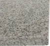 A close-up view of a speckled granite surface, likely a pizza stone. Podgląd zdjęcia produktu