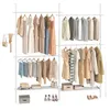 A white garment rack with multiple shelves and hanging clothes, shoes, and accessories. Produktbild-Vorschau