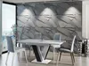 A modern dining room with a geometric textured wall, a dining table and chairs, and decorative vases. Náhled obrázku produktu