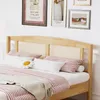 A bedroom scene with a bed and framed artwork on the wall. Náhľad obrázku produktu
