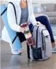 A person is holding a blender next to a backpack and yoga mat. Podgląd zdjęcia produktu