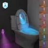 A toilet with a glowing toilet seat light and a wall-mounted light. Náhled obrázku produktu