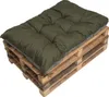 A green cushion placed on a wooden pallet.