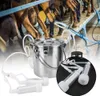 Goats being milked with a milking machine. Produktbild-Vorschau