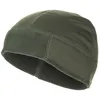 A close-up studio shot of a green fleece beanie.