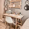 A home office setup with a wooden desk, chair, and wall-mounted shelving. Anteprima dell’immagine prodotto