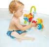 A young child is playing with a bath toy in a bathtub. Podgląd zdjęcia produktu