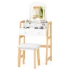 A white vanity table with a lighted mirror and a matching stool, set against a white background. Produktbild-Vorschau