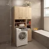 A laundry room with a washing machine and storage cabinets. Náhled obrázku produktu