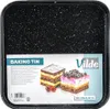 A baking tin with speckled black exterior, featuring two slices of cake and cherries on a white background with text and branding. Podgląd zdjęcia produktu
