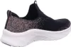 A side view of a black Skechers sneaker with pink accents. Náhled obrázku produktu