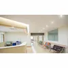 A clean, modern hospital or clinic waiting area with a reception desk and seating. Produktbild-Vorschau