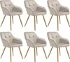 Six beige upholstered dining chairs with gold legs are arranged in two rows of three against a white background. Náhled obrázku produktu