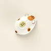 A top-down view of a cat-shaped computer mouse on a light beige background. Náhled obrázku produktu