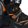 A close-up view of a black and orange inline skate. Podgląd zdjęcia produktu