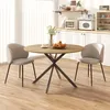 A round dining table with two chairs in a kitchen or dining room setting. Produktbild-Vorschau
