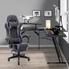 A gaming setup with a desk, chair, and computer equipment. Náhled obrázku produktu
