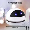 A white mini desktop vacuum cleaner with blue LED eyes is shown with size indicators and USB charging cables. Produktbild-Vorschau