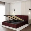 A bedroom with a burgundy upholstered bed frame with its storage compartment open. Produktbild-Vorschau