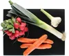 Various vegetables arranged on a black cutting board. Náhled obrázku produktu