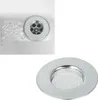 A close-up of a sink drain with a metal strainer, and a separate image of the strainer itself. Produktbild-Vorschau