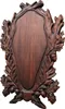 A wooden plaque with oak leaf and acorn carvings, designed for mounting trophies. Produktbild-Vorschau