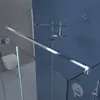 A modern bathroom with a glass shower enclosure, a toilet, and a shower head. Produktbild-Vorschau