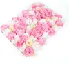 A close-up, angled view of a floral wall panel made of artificial flowers in shades of pink, white, and cream. Podgląd zdjęcia produktu
