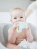A baby is sitting in a bathtub and playing with a rubber duck toy. Produktbild-Vorschau