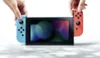 Nintendo Switch mit neonblauem und neonrotem Joy-Con Produktbild-Vorschau 5