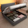 A bed with its storage compartment open, revealing stored items. Anteprima dell’immagine prodotto
