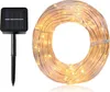 A solar panel and a coiled string of lights. Produktbild-Vorschau