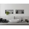 A modern bathroom vanity with a vessel sink, faucet, and decorative items. Náhled obrázku produktu