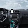 A car's dashboard with a phone mounted on it, displaying navigation. A small device is shown near the gear shift, with a wireless signal icon. Podgląd zdjęcia produktu