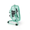 A close-up side view of a turquoise desk fan. Podgląd zdjęcia produktu
